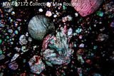Hectic Mini-Moon Collisions in the Early Solar System Produced the Grains Packed Inside Meteorites